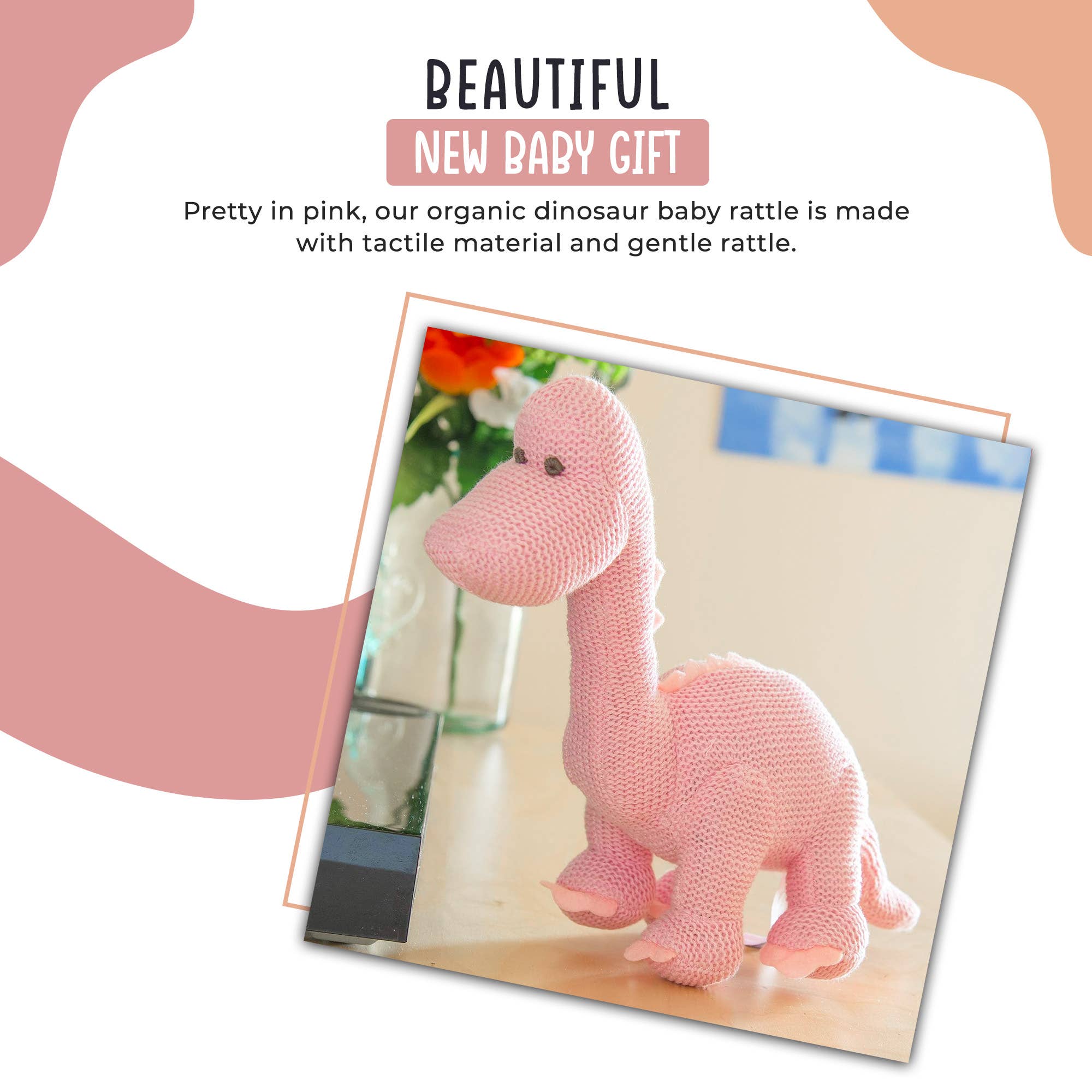 Hochet dinosaure diplodocus rose en coton biologique tricoté